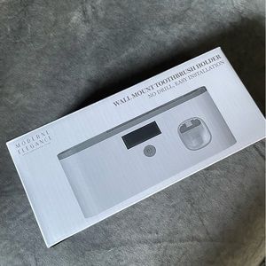 Wall mount toothbrush holder